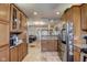 Bright kitchen with granite countertops, stainless steel refrigerator, and tile flooring at 2332 Central Ave, Indianapolis, IN 46205