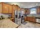 Updated kitchen with stainless appliances, tile floor and granite countertops at 2332 Central Ave, Indianapolis, IN 46205
