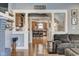 Inviting living space featuring hardwood floors, decorative columns, and an open layout at 2332 Central Ave, Indianapolis, IN 46205