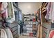 Organized walk-in closet featuring shelving, hanging rods, and ample space for clothing and shoe storage at 2332 Central Ave, Indianapolis, IN 46205