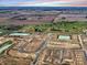 Expansive aerial view of a new construction community surrounded by green spaces and farmland at 2755 Muirfield St, Franklin, IN 46131