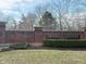 Image shows Franklin College sign made of red brick, surrounded by greenery and a manicured lawn at 2755 Muirfield St, Franklin, IN 46131