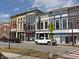 Street view of historic buildings and local businesses, lined with parked vehicles and pedestrian signs at 2755 Muirfield St, Franklin, IN 46131