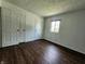Bedroom features wood flooring and a window at 3415 Winchester Dr, Indianapolis, IN 46227