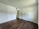 Bedroom featuring wood flooring, a closet, and a bathroom at 3415 Winchester Dr, Indianapolis, IN 46227