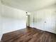 Bedroom featuring wood flooring, a closet, and a bathroom at 3415 Winchester Dr, Indianapolis, IN 46227