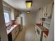 Practical kitchen with sink, refrigerator, countertops and generous storage at 3415 Winchester Dr, Indianapolis, IN 46227