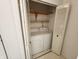 Laundry closet with a washer and dryer and shelving at 3415 Winchester Dr, Indianapolis, IN 46227