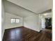 Inviting living room featuring wood-look floors, neutral walls, and ample natural light at 3415 Winchester Dr, Indianapolis, IN 46227