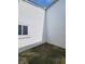 Enclosed patio area with vinyl siding and concrete flooring, providing a private outdoor space at 3415 Winchester Dr, Indianapolis, IN 46227