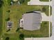 Aerial view showcasing a large backyard with a patio, playground, and well-maintained lawn at 3679 Woodruff Pl, Bargersville, IN 46106