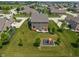 Aerial view of a large property featuring a home, backyard, playground, and a serene neighborhood at 3679 Woodruff Pl, Bargersville, IN 46106