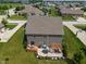 Aerial view of brick home with wooden deck, patio, pergola, and spacious lawn at 3679 Woodruff Pl, Bargersville, IN 46106