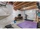 Basement workout area with plastic on the walls, a tv, and a treadmill at 3679 Woodruff Pl, Bargersville, IN 46106