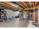 Unfinished basement with exposed beams, concrete walls, and storage items at 3679 Woodruff Pl, Bargersville, IN 46106