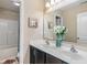 Bright bathroom with a double sink vanity, a large mirror, and a shower-tub combination at 3679 Woodruff Pl, Bargersville, IN 46106