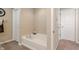 Bright bathroom with a soaking tub and modern fixtures, offering a relaxing and spa-like experience at 3679 Woodruff Pl, Bargersville, IN 46106