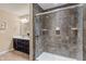 Bathroom featuring a glass door shower, a tiled wall, and a dual sink vanity at 3679 Woodruff Pl, Bargersville, IN 46106