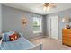 Cozy bedroom with fox themed decorations, single bed and natural light from window at 3679 Woodruff Pl, Bargersville, IN 46106