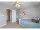 bedroom with fox themed wall decor, single bed, carpet floor, and natural light from window at 3679 Woodruff Pl, Bargersville, IN 46106