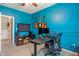 Bright bedroom with guitars displayed on the wall and a work space with dual monitors at 3679 Woodruff Pl, Bargersville, IN 46106