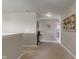 Hallway with neutral walls, carpet floors, decorated with flowers and artistic wall art at 3679 Woodruff Pl, Bargersville, IN 46106