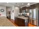 Well-designed kitchen featuring a central island, granite countertops, and stainless steel appliances at 3679 Woodruff Pl, Bargersville, IN 46106