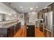 Spacious kitchen with granite countertops, stainless steel appliances, and dark wood cabinetry at 3679 Woodruff Pl, Bargersville, IN 46106