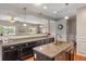 Granite countertops and dark wood cabinetry create an ideal space for culinary experiences at 3679 Woodruff Pl, Bargersville, IN 46106