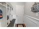 Mudroom with storage lockers, a bench, coat hooks, and a door to the exterior at 3679 Woodruff Pl, Bargersville, IN 46106