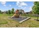 Backyard playground featuring a wooden playset with a slide and swings for Gathering fun at 3679 Woodruff Pl, Bargersville, IN 46106