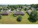 Overhead view of homes with brick exteriors, grassy yards, mature trees, and well-maintained landscaping at 370 Vinewood S Dr, Brownsburg, IN 46112