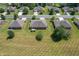 An aerial view shows the backyard of single-Gathering homes in a quiet neighborhood at 370 Vinewood S Dr, Brownsburg, IN 46112
