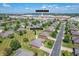 Aerial view of single-Gathering home with Brownsburg High School in the background in a quiet neighborhood at 370 Vinewood S Dr, Brownsburg, IN 46112