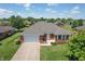 Aerial perspective showcasing a brick home with a well-kept yard and established landscaping at 370 Vinewood S Dr, Brownsburg, IN 46112