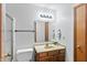 Bathroom featuring a vanity with a sink, mirror, and shower with a towel rack at 370 Vinewood S Dr, Brownsburg, IN 46112