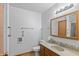 Bathroom featuring a vanity with sink, mirror, and shower with towel racks at 370 Vinewood S Dr, Brownsburg, IN 46112
