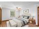 Cozy bedroom featuring a comfortable bed, ceiling fan, and natural light, perfect for rest and relaxation at 370 Vinewood S Dr, Brownsburg, IN 46112