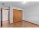 Bedroom with wood-look flooring, a closet, and a bright and airy feel at 370 Vinewood S Dr, Brownsburg, IN 46112