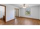 Bedroom featuring hardwood floors, window for natural light, and closet with mirrored doors at 370 Vinewood S Dr, Brownsburg, IN 46112