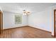 Bright bedroom with ceiling fan, hardwood floors, and a window providing natural light at 370 Vinewood S Dr, Brownsburg, IN 46112