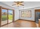 Cozy dining area with large windows, hardwood floors, and stylish lighting, creating a warm and inviting atmosphere at 370 Vinewood S Dr, Brownsburg, IN 46112
