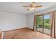 Bright dining room, featuring a sliding glass door opening to a patio area with exterior landscaping at 370 Vinewood S Dr, Brownsburg, IN 46112