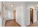 Hallway with several doors and neutral colored walls leading into other rooms of the home at 370 Vinewood S Dr, Brownsburg, IN 46112
