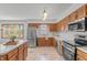 Kitchen with stainless steel appliances and plenty of counter space, ideal for cooking and entertaining at 370 Vinewood S Dr, Brownsburg, IN 46112