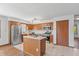 Charming kitchen equipped with stainless steel appliances, ample cabinetry, and an island at 370 Vinewood S Dr, Brownsburg, IN 46112