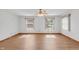 Bright living room featuring wood floors, multiple windows allowing natural light to fill the room at 370 Vinewood S Dr, Brownsburg, IN 46112