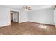 Bright living room featuring wood floors and a ceiling fan providing comfortable lighting and air circulation at 370 Vinewood S Dr, Brownsburg, IN 46112