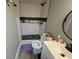 Updated bathroom featuring a modern shower with subway tile and stylish vanity at 3836 N Wittfield St, Indianapolis, IN 46235