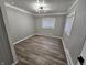 Cozy bedroom with natural light, hardwood floors, and fresh paint, perfect for relaxation at 3836 N Wittfield St, Indianapolis, IN 46235